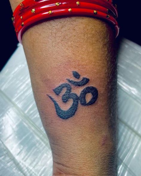 Om Wrist Tattoo