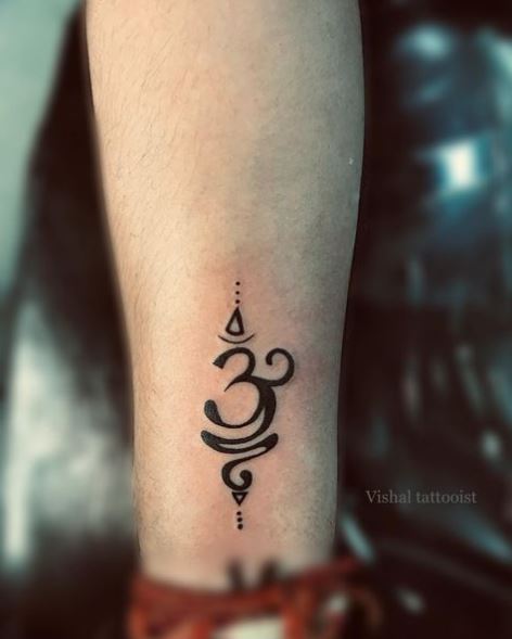 Black Om Wrist Tattoo