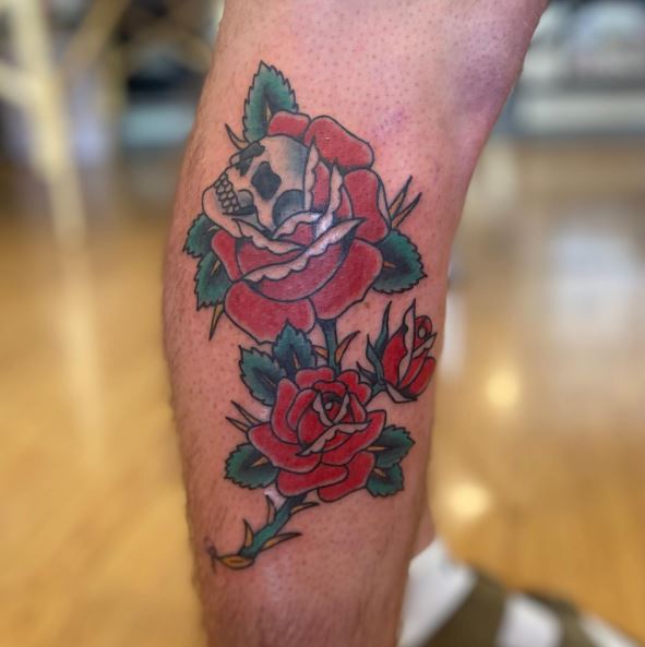 Red Roses and Skull Calve Muscle Tattoo