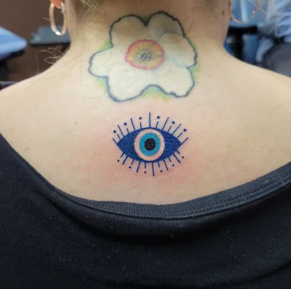 Flower and Blue Evil Eye Back Tattoo