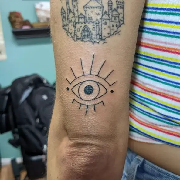 Black Minimalistic Evil Eye Elbow Tattoo