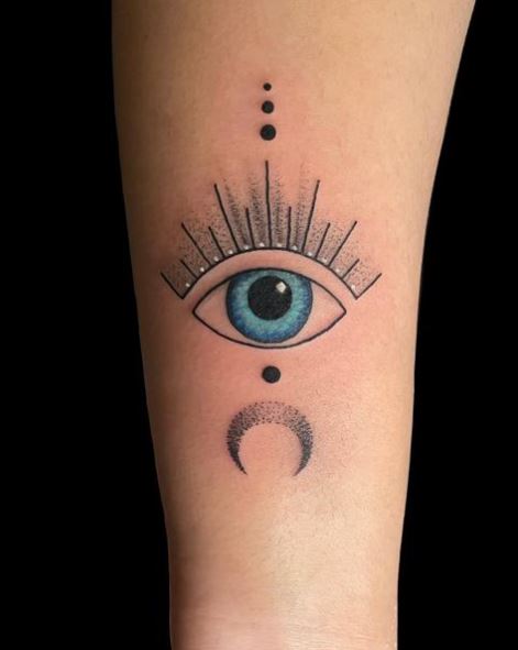 Half Moon and Big Blue Evil Eye Forearm Tattoo