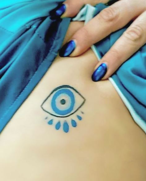 Black and Blue Evil Eye Ribs Tattoo