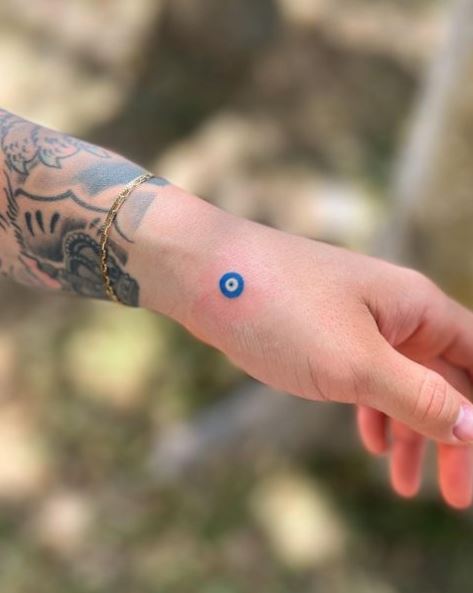 Minimalistic Blue Evil Eye Hand Tattoo