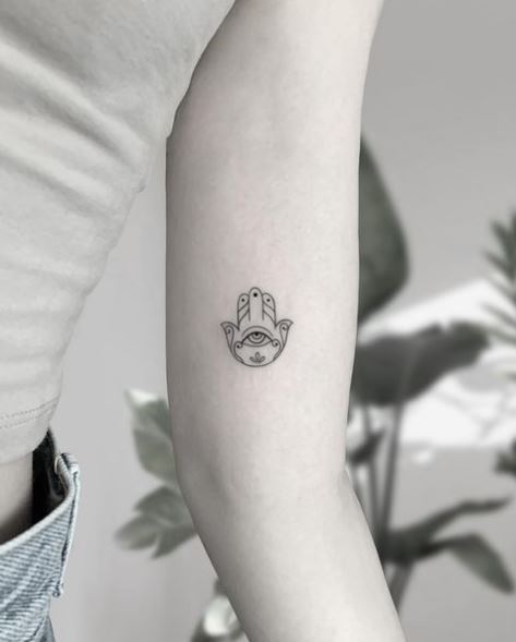 Minimalistic Hamsa Hand Biceps Tattoo