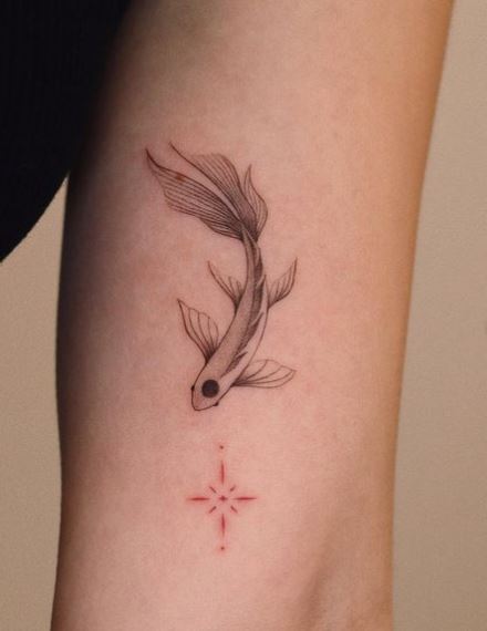 Minimalistic Koi Fish Biceps Tattoo