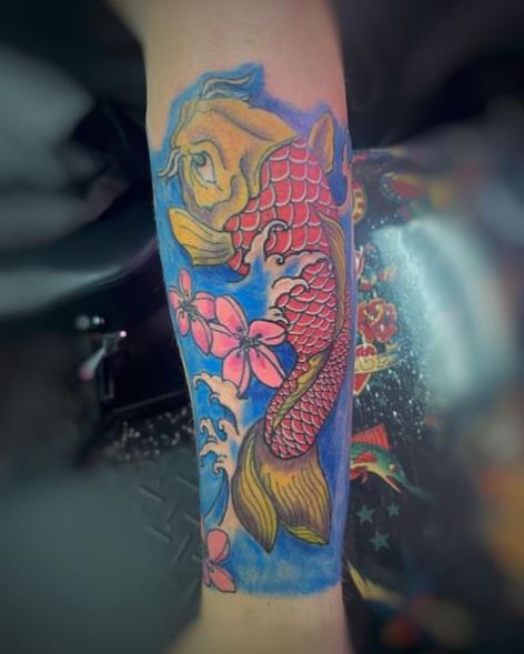 Colorful Flowers and Koi Fish Forearm Tattoo