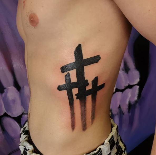 Three Black Crosses Ribs Tattoo