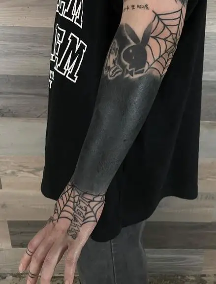 Playboy Bunny and Spider Web Arm Sleeve Tattoo