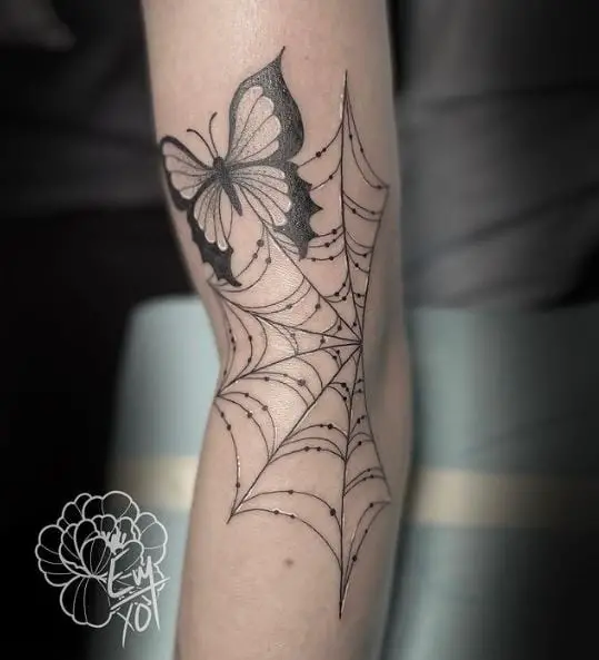 Butterfly and Spider Web Arm Tattoo