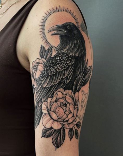 A Perched Raven and Flowers Tattoo