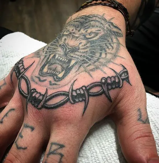 Barbed Wire Knuckle Dusters and Tiger Face Tattoo