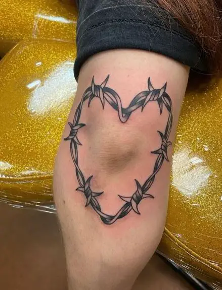 Barbed wire heart elbow tattoo piece