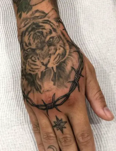 Barbed wire tattoo around the knuckles