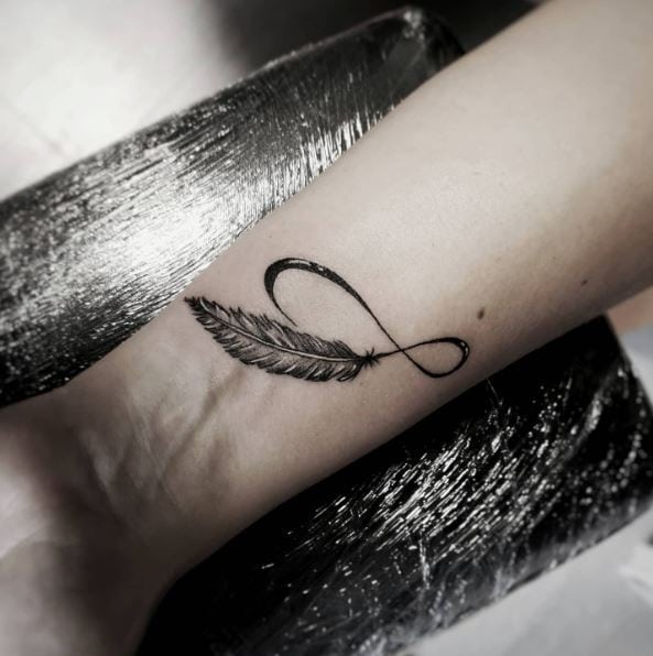 Black Ink Infinity Feather Wrist Tattoo