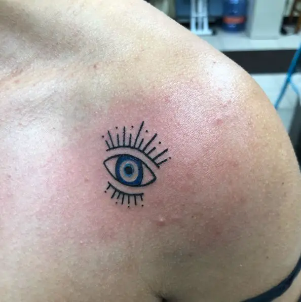 Black and Blue Evil Eye Tattoo