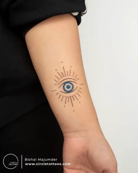 Black and Blue Evil Eye Wrist Tattoo