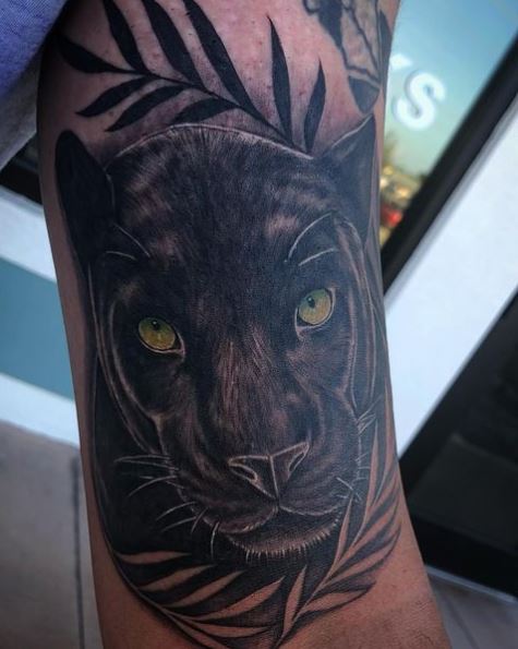 Green Eyed Black Panther Tattoo with Leaves