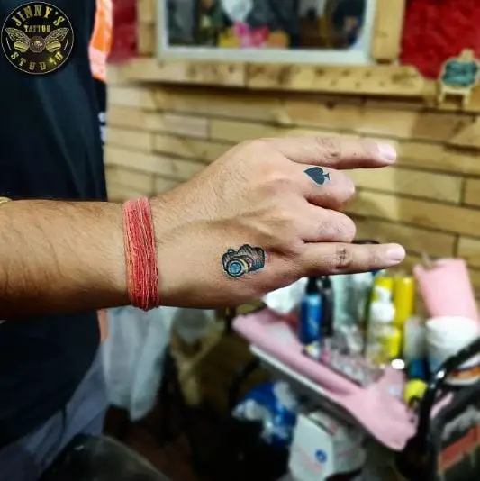 Black Small Spade Tattoo On Tall Finger