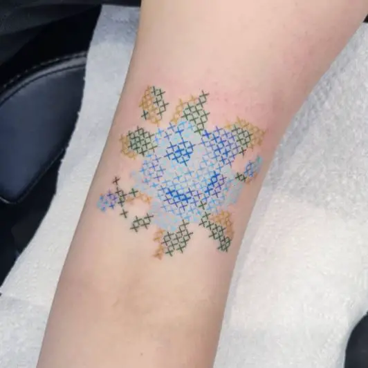 Blue Green and Brown cross stitch pattern tattoo