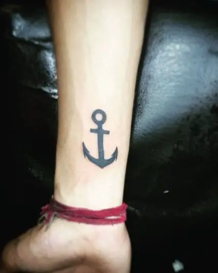 Bold Ink Anchor Hand Tattoo