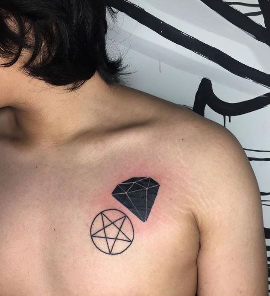 Bold Ink Black Diamond Chest Tattoo