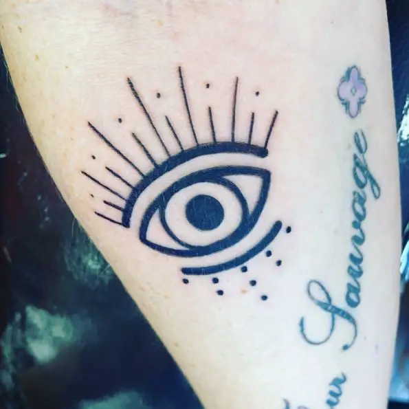 Bold Black Evil Eye Tattoo Piece