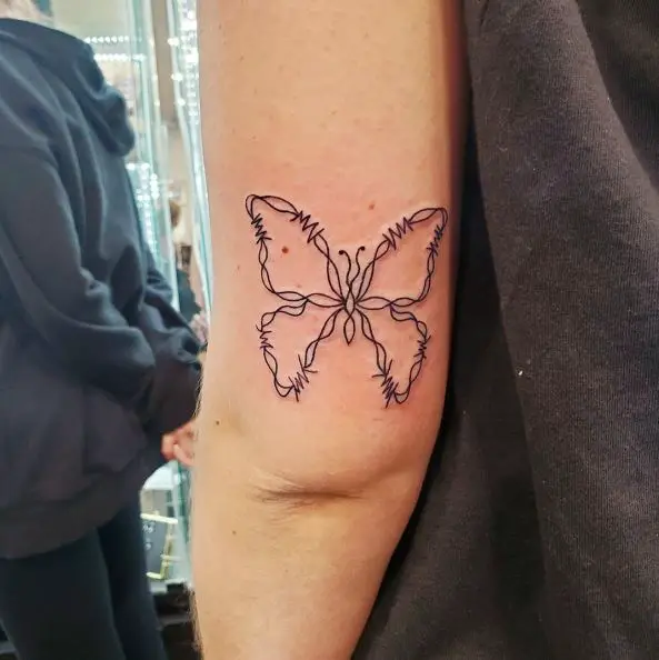 Butterfly Shaped Barbed Wire Tattoo