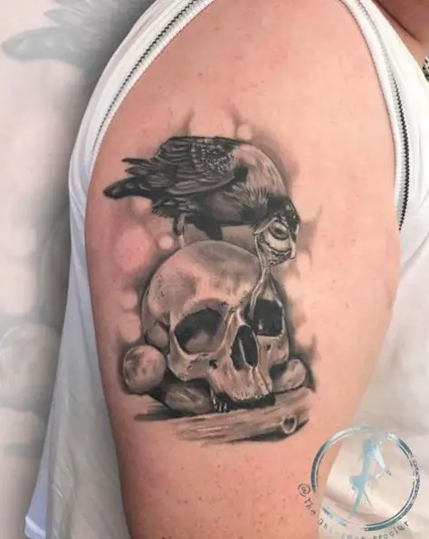 Crow Pulling the Eye of the Skull Tattoo