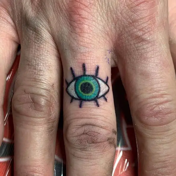 Colored Evil Eye Tattoo On Finger