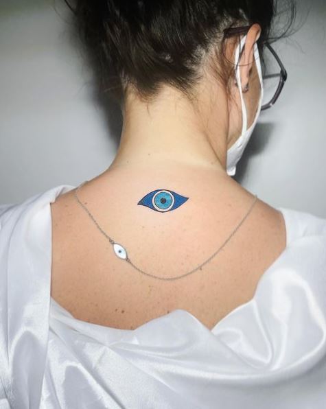Eye Shaped Amulet Tattoo on the Back
