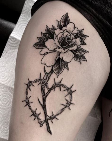 Flower Stuck On Barbed Wire Tattoo