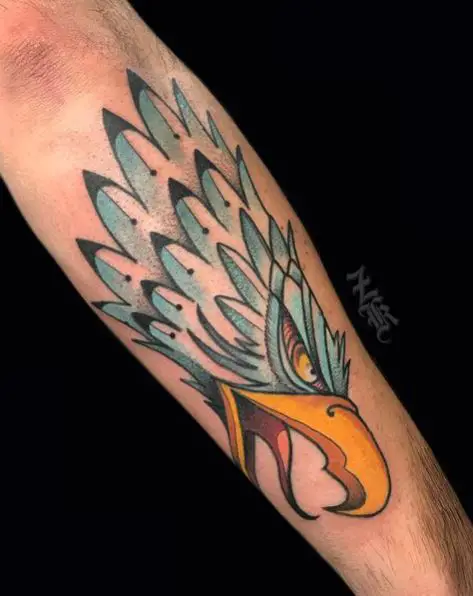 Blue and Yellow Eagle Head Tattoo on Forearm