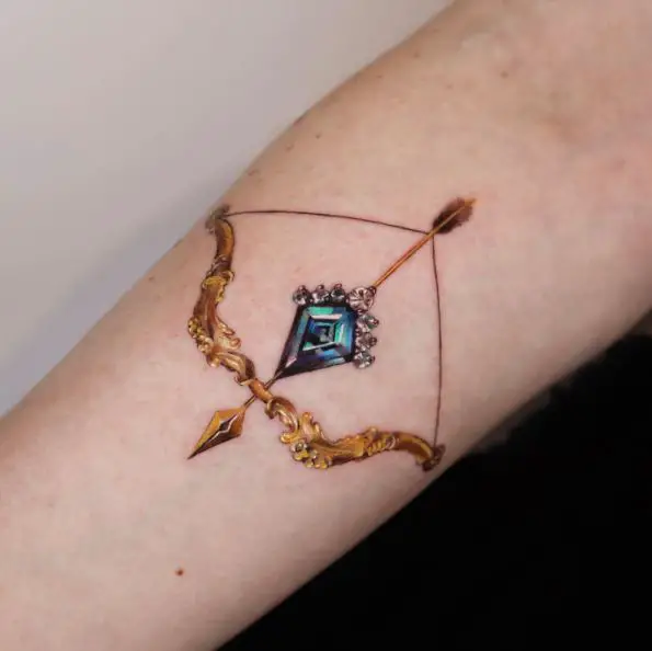 Gold Bow with Blue Diamond Arrow Tattoo