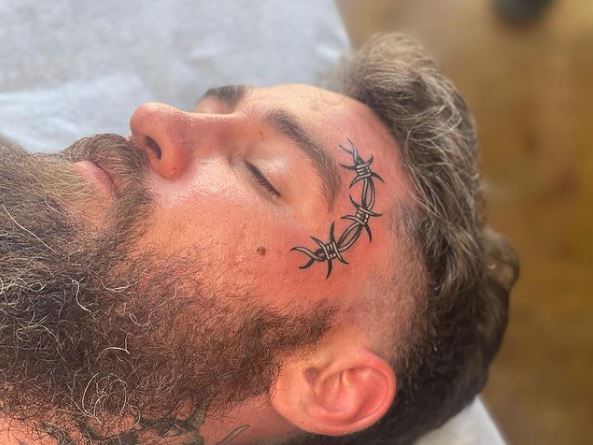 Grey Barbed Wire Tattoo on Forehead