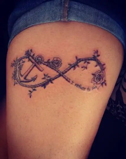 Infinity anchor tattoo looped in rope intertwined with tiny roses