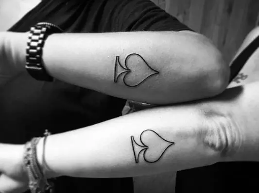Matching Spade Symbol Tattoo on Hands