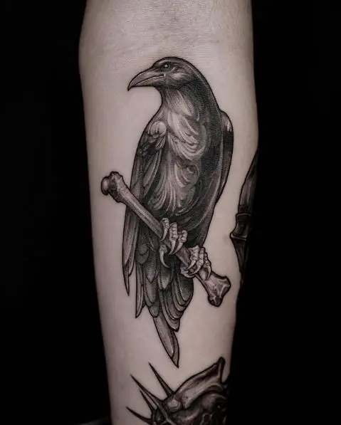 Raven Sitting on a Branch Tattoo