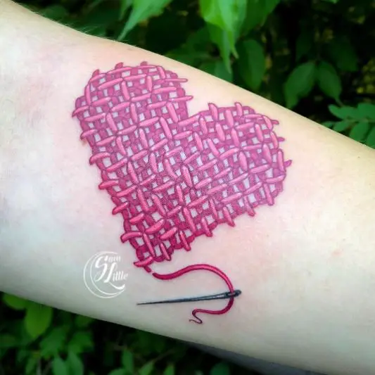 Realistic cross stitch heart tattoo