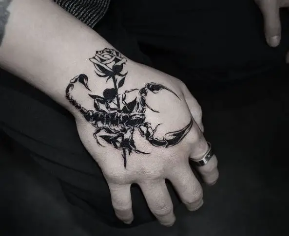 Rose And Scorpion Hand Tattoo