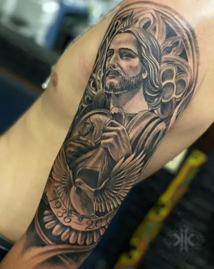 Pigeon and San Judas Arm Sleeve Tattoo