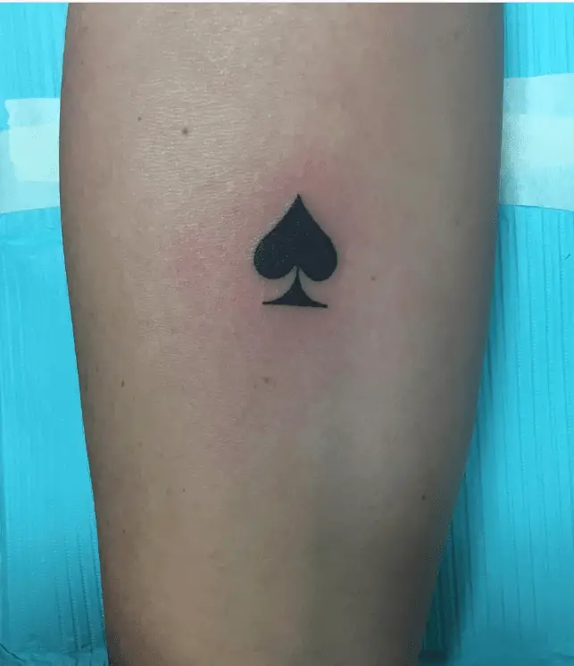 Tiny Black Spade Hand Tattoo