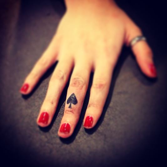 Tiny Black Spade Tattoo On Finger