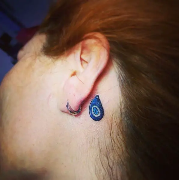 Tiny Evil Eye Tattoo Behind the Ear
