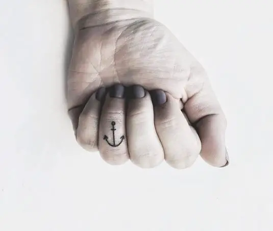 Tiny Line Anchor Tattoo On Ring Finger