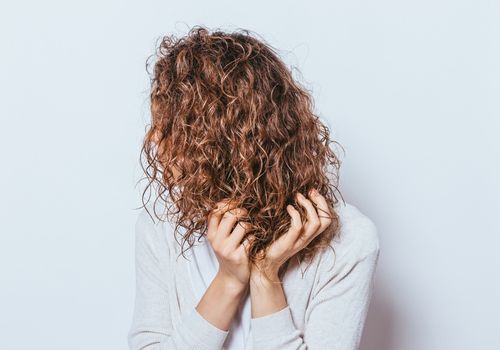 Woman with Curly Brown Hair