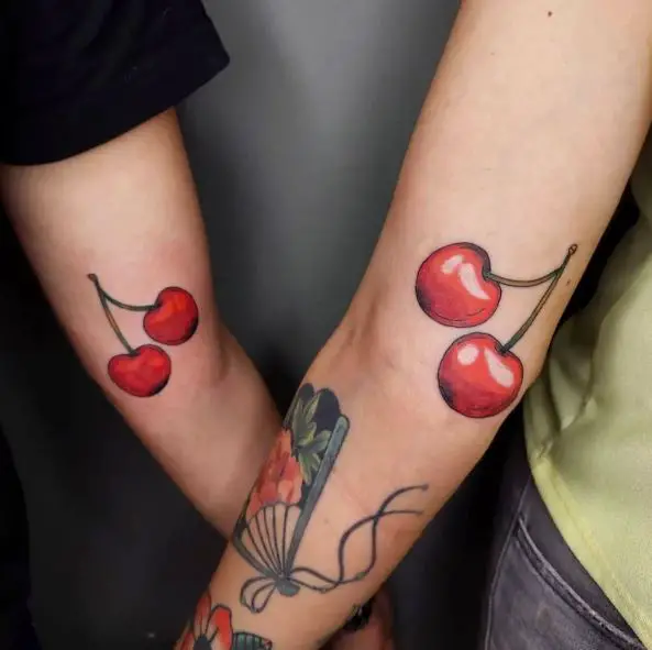 Couple with Cherry Arm Tattoos