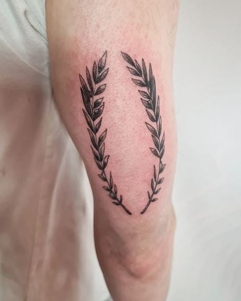Black and Grey Laurel Wreath Arm Tattoo