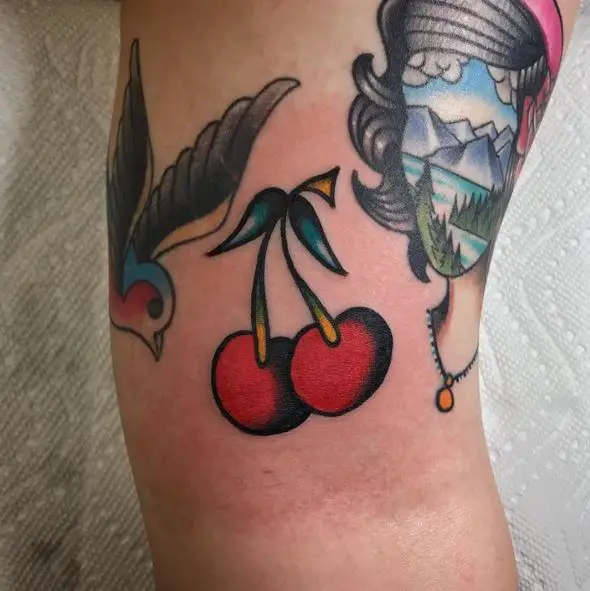 Bird and Cherries Arm Tattoo