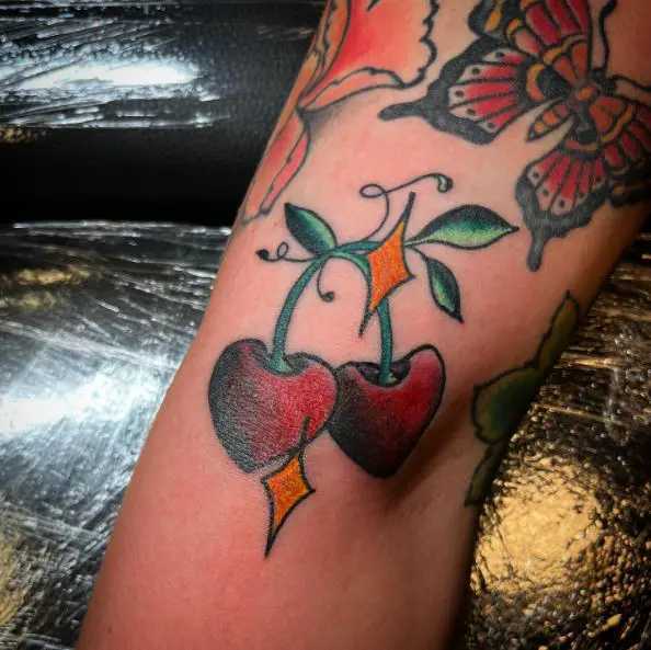 Colorful Diamonds and Cherries Arm Tattoo